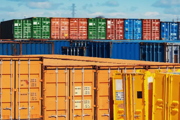 Shipping containers that maritime workers need to be working on top of with a fall protection system